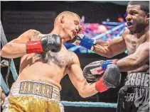  ?? ROBERTO E. ROSALES/JOURNAL ?? Jose Luis Sanchez, left, battles Detroit’s Reggie Harris Friday night at the Fight Nights Bouts event at the Santa Ana Events Center. Sanchez earned a majority decision.