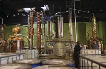  ??  ?? ABOVE: Copper stills and fermenters at the Okanagan Spirits Craft Distillery in Vernon. Among the distillery’s offerings are Canada’s first fruit-based absinthe, plus vodka, whisky and a caraway-flavoured aquavit. TOP: A lone downhill skier carves through the powder on a run at Silverstar Mountain Resort.