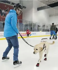  ??  ?? Emily Molchan skates with guide dog Remington.