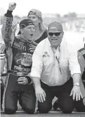  ?? STRICKLAND/AP
TOM ?? Jamie McMurray, left, and car owner Chip Ganassi celebrate after McMurray won the 2010 Brickyard 400.