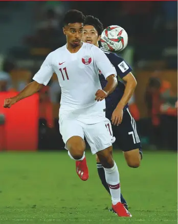  ??  ?? Too good...Akram Afif gets away from Takehiro Tomiyasu in the Asian Cup Final