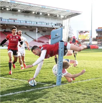  ??  ?? Gloucester’s Jonny May touches the ball down but the score was ruled out