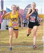  ?? [CHRIS LANDSBERGE­R/ THE OKLAHOMAN] ?? Piedmont's Rachel Caldwell (478) and Noble's Kenzie Heeke (466) cross the finish line during the Class 5A girls cross country state championsh­ips at Edmond Santa Fe High School on Wednesday.