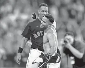  ?? ERIK WILLIAMS/USA TODAY SPORTS ?? Michael Brantley, left, and Jose Altuve celebrate Sunday’s win over the Yankees but are skipping playing in the All-Star Game.