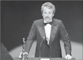  ?? THE ASSOCIATED PRESS ?? William Goldman accepts his Oscar at Academy Awards in Los Angeles, for screenplay from other medium for “All The President’s Men.” Goldman, the Oscar-winning screenplay writer of “Butch Cassidy and the Sundance Kid” and “All the President’s Men” William Goldman died, Friday. He was 87.
