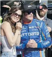  ?? — AP FILES ?? Indy 500 champ Scott Dixon, his wife Emma, and former champion Dario Franchitti were robbed at gunpoint in a Taco Bell drive-thru Sunday.