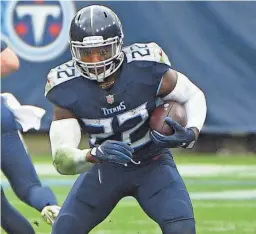  ?? STEVE ROBERTS/USA TODAY SPORTS ?? Titans running back Derrick Henry carries against the Texans on Sunday. Henry had 264 yards from scrimmage in the game.