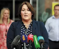  ??  ?? JUSTICE: Caroline Donohoe, wife of Det Gda Adrian Donohoe, speaking outside the court. Photo: Gerry Mooney