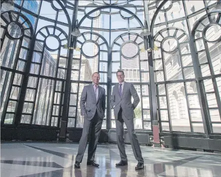  ?? CRYSTAL SCHICK ?? John Moss, vice-president retail leasing and sales of CBRE Limited, left, and Bryan Walsh, senior vice-president, in the Canadian Pacific Railway building in downtown Calgary. The complex, which includes the office block, rotunda and great hall, is up...