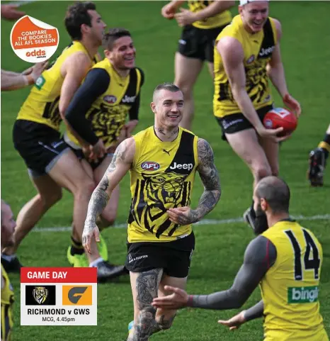  ?? PHOTO: JULIAN SMITH/AAP ?? READY: Richmond midfield star Dustin Martin (centre) trains at Punt Road Oval in Melbourne.