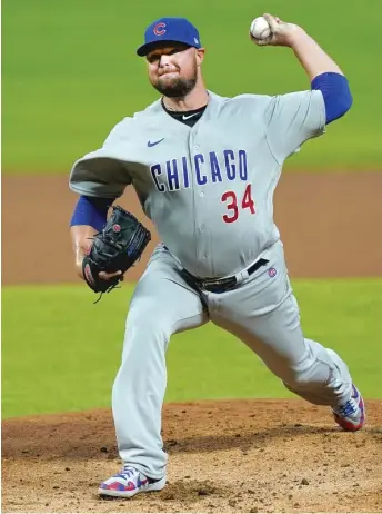  ?? BRYAN WOOLSTON/AP ?? Jon Lester was in fine form, pitching five hitless innings against the Reds on Monday night.