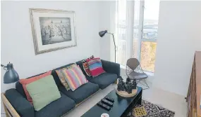  ??  ?? The TV room doubles as a guest room, as cushions lift off an Eames sofa to create a bed. Beckerman inherited the mid-century modern piece from his parents and had it reupholste­red. The Apache fire dance drawing over the sofa is by Allan Houser. An...