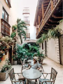  ??  ?? L Old and new Cartagena at sundown from Movich Hotel's rooftop lounge
T Luxury fashion finds inside St. Dom Cartagena featuring emerging designers from Latin America
B Hotel Casa La Factoria; a former colonial house restored to provide modern services