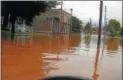  ?? PHOTO COURTESY OF RONNIE AND LENA PRESLEY ?? Sconondoa Street in Oneida during the June 2013flood.