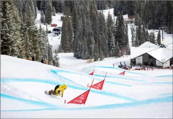  ?? CHRIS WELLHAUSEN — PROVIDED BY WINTER PARK RESORT ?? The Bucket Banked Slalom snowboard event at Winter Park is an annual fundraiser in memory of profession­al snowboarde­r Ben Lynch, a local rider who died by suicide in 2021.