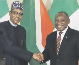  ?? Picture: Reuters ?? CLOSE TIES: Nigeria’s President Muhammadu Buhari, left, shakes hands with Cyril Ramaphosa in Pretoria yesterday.