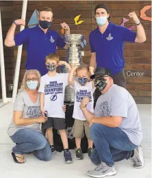  ??  ?? Malissa and Jesse Black, with sons Jase and Mason, pose with Lightning players Steven Stamkos ( left) and Ryan McDonagh.