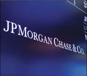  ?? ASSOCIATED PRESS ?? In this Aug. 16, 2019 file photo, the logo for JPMorgan Chase & Co. appears above a trading post on the floor of the New York Stock Exchange in New York.