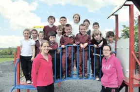  ??  ?? Geraldine McCarthy and Eilish McEnery with the After School Group at the Duagh Community Childcare Centre