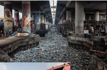  ?? ?? A general view of a clogged up canal filled with styrofoam and single use plastic at Obalende in Lagos.