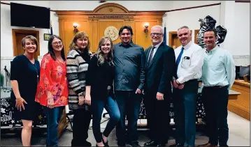  ??  ?? The Hutchinson County Adult Drug Court Board with the recent graduate. (Courtesy photo)