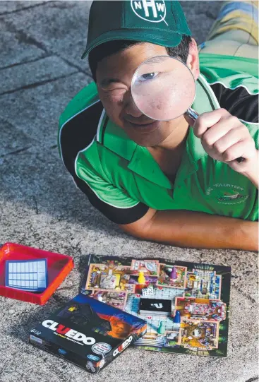  ?? Picture: ANNA ROGERS ?? EYE ON CRIME: Woree Neighbourh­ood Watch co-ordinator Alwin Koo plays Cluedo.