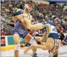  ?? NATE HECKENBERG­ER — FOR DIGITAL FIRST MEDIA ?? West Chester Rustin’s Brett Kaliner works for a takedown against Bald Eagle’s Garrett Rigg during a 5-1 decision in the 126-pound first round bout.