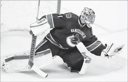  ?? By Anne-marie Sorvin, US Presswire ?? Tough to trade:
The Canucks could deal goaltender Roberto Luongo, making a save April 11, but his contract is a stumbling block.