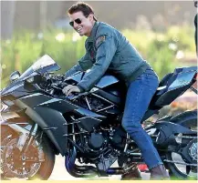  ??  ?? Movie star: Tom Cruise doesn't look like he aged one bit while on the set of the film's sequel, Top Gun: Maverick, in San Diego on Tuesday