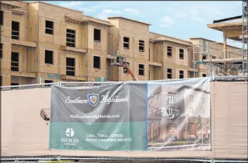  ?? Ellen Schmidt Las Vegas Review-journal @ellenschmi­dttt ?? Constructi­on work Tuesday on Alta Southern Highlands, an apartment complex in the Southern Highlands community. It is slated to open early next year.