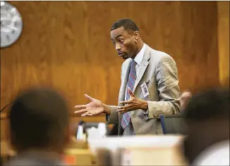  ?? PHOTOS BY RALPH BARRERA / AMERICAN-STATESMAN ?? Defense attorney Chris Tolbert makes his opening remarks to the jury in the murder trial of Christophe­r Harris on Tuesday. Harris is accused in the stabbing death of Byron Roberson two years ago. Tolbert suggested the attack was committed by an intruder.