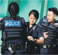  ?? Reuters ?? Singapore police practise responding to a terrorist incident in a simulated attack by gunmen at a housing estate in the state in December last year. Security forces have increased these drills in and around the city in recent months