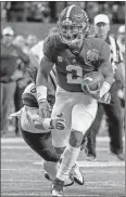  ?? Butch Dill / AP ?? Alabama quarterbac­k Jalen Hurts carries for a first down during the Peach Bowl on Dec. 31.