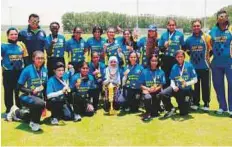  ?? Courtesy: Organisers ?? Desert Cubs Cricket Academy women’s team with their coaches after winning the Emirates Cricket Board Women’s Cricket League.