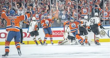  ?? SHAUGHN BUTTS/POSTMEDIA ?? The Edmonton Oilers celebrate a goal by Leon Draisaitl on Sunday during a 7-1 win over the Anaheim Ducks in Game 6 of their second-round playoff series. Game 7 is scheduled for Wednesday in Anaheim.