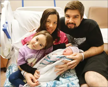  ?? CHRIS RILEY — TIMES-HERALD ?? Proud big sister Emerence Feeney along with her parents, Tamara and Brian, welcomed baby Esme, the first baby born in Solano County at NorthBay Health Center in Fairfield on Wednesday.