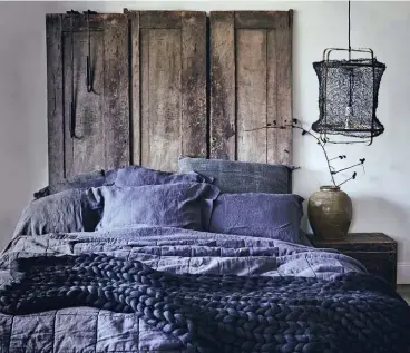  ??  ?? |BOTTOM RIGHT|
Dark, bountiful bedding helps you replicate the practice of hibernatio­n. While humans only “hibernate” overnight, we’re still part of nature. Marie says layers of pillows, bedspreads and blankets form a snug cocoon to sink into after a long day.