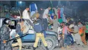  ?? AP ?? Police use force to disperse supporters of Nawaz Sharif, who had gathered to see him in Lahore on Friday.