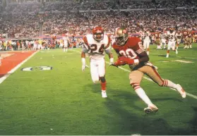  ?? Focus On Sport / Getty Images 1989 ?? Julian Edelman, above, the Super Bowl MVP of 2019, has tried to emulate the work ethic of Jerry Rice, the Super Bowl MVP in 1989, shown at left, scoring against the Bengals during Super Bowl XXIII on Jan. 22, 1989.