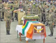  ?? PTI ?? Army officials pay tributes to SFF commando Nyima Tenzin during a wreath-laying ceremony in Leh on Monday.