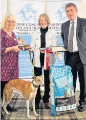  ??  ?? Success Patron Rosemary Long, therapet volunteer June Symmons with Daisy and CCST chairman Allan Sim