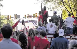  ?? TRAVIS LONG tlong@newsobserv­er.com ?? NC State fans watch the Wolfpack play Purdue in the Final Four during a watch party on Hillsborou­gh Street in Raleigh on Saturday. Purdue won 63-50.