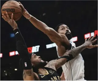  ?? ?? Toronto Raptors’ Gary Trent Jr. (left) shoots as Dallas Mavericks’ Spencer Dinwiddie defends during first-half NBA basketball game action in Toronto on Saturday, Nov. 26, 2022 (November 27 in Manila). AP PHOTO points off six Toronto turnovers to lead 29-24 after one. The Raptors