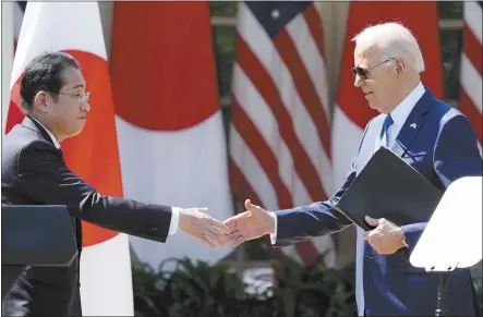  ?? AP photo ?? President Joe Biden and Japanese Prime Minister Fumio Kishida shake hands after holding a joint news conference in the Rose Garden of the White House on Wednesday, in Washington.