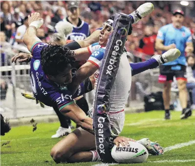  ?? PHOTO: GETTY IMAGES ?? What he does best . . . Dallin WateneZele­zniak, of the New Zealand Warriors, scores one of his trademark corner post tries during his team’s round seven NRL match against the St George Illawarra Dragons at WIN Stadium in Wollongong yesterday.