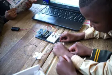  ??  ?? The coding club kids use electronic boards to make temporary circuits and prototypes to devise solutions for problems they’ve identified in their community. This programme aims to provide, both teachers and learners, with important skills in the increasing­ly digital world and economy. — AFP photo