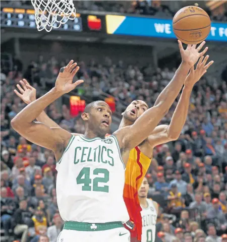  ?? ASSOCIATED PRESS ?? NOT QUITE RIGHT: Al Horford (42) believes the Celtics need to play better team basketball and understand their roles in order to snap out of a funk in which they have lost four of the past five games, all on the road.