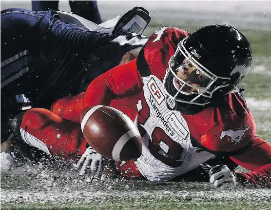  ?? TONY CALDWELL ?? Calgary Stampeders receiver Kamar Jorden fumbled the ball close to the Toronto Argonauts’ goal-line and could only watch as Argos defender Cassius Vaughn scooped it up and ran the ball back 109 yards for a touchdown late in the fourth quarter of...