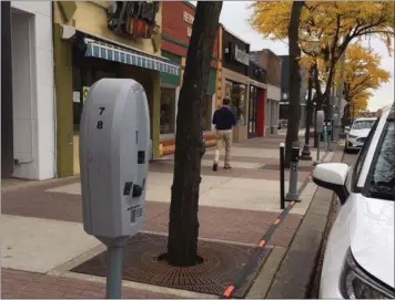  ?? ROYAL OAK TRIBUNE FILE PHOTO ?? New smart parking meters were tested earlier this fall along one block on the east side of Main Street between Third and Fourth streets in downtown Royal Oak. Many of the city’s more than 800 older smart meters will no longer support their smart-meter functions by New Year’s Day. Police are working to upgrade the parking system and asking residents to take a short survey online to guide them in the process.