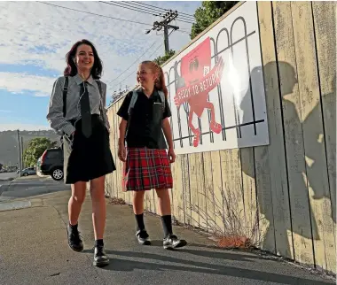  ?? PHOTO: JOSEPH JOHNSON/FAIRFAX NZ ?? Redcliffs teenagers Imogen Crooks, 16, left and Emilia Crooks, 13, walk to the bus stop on their way to Linwood College.